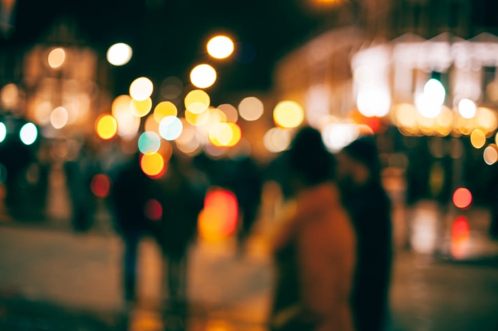 people walking across the street bokeh photography preview