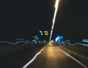 timeplapse photography of roads at night thumbnail