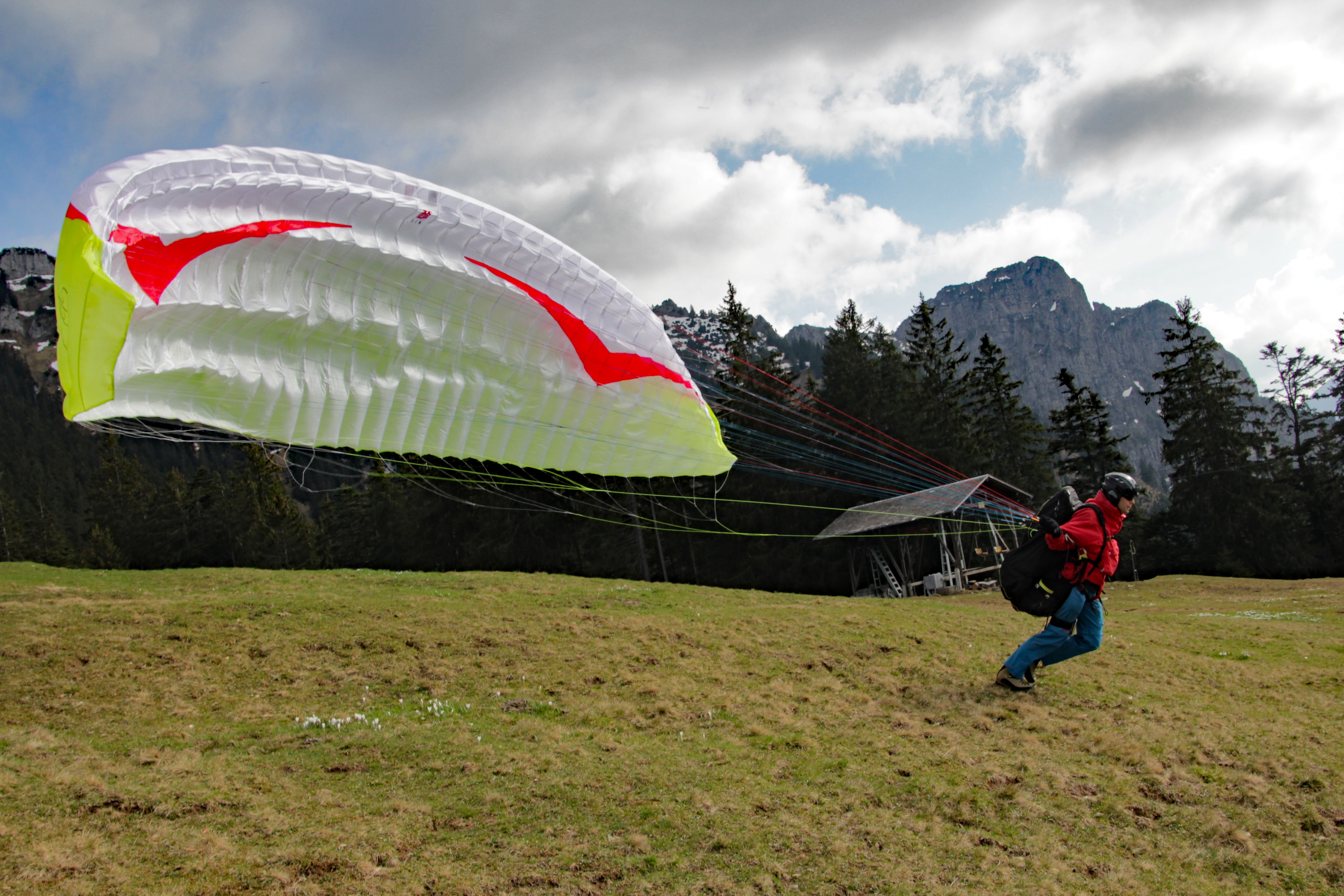 men's red shirt with white paraglider