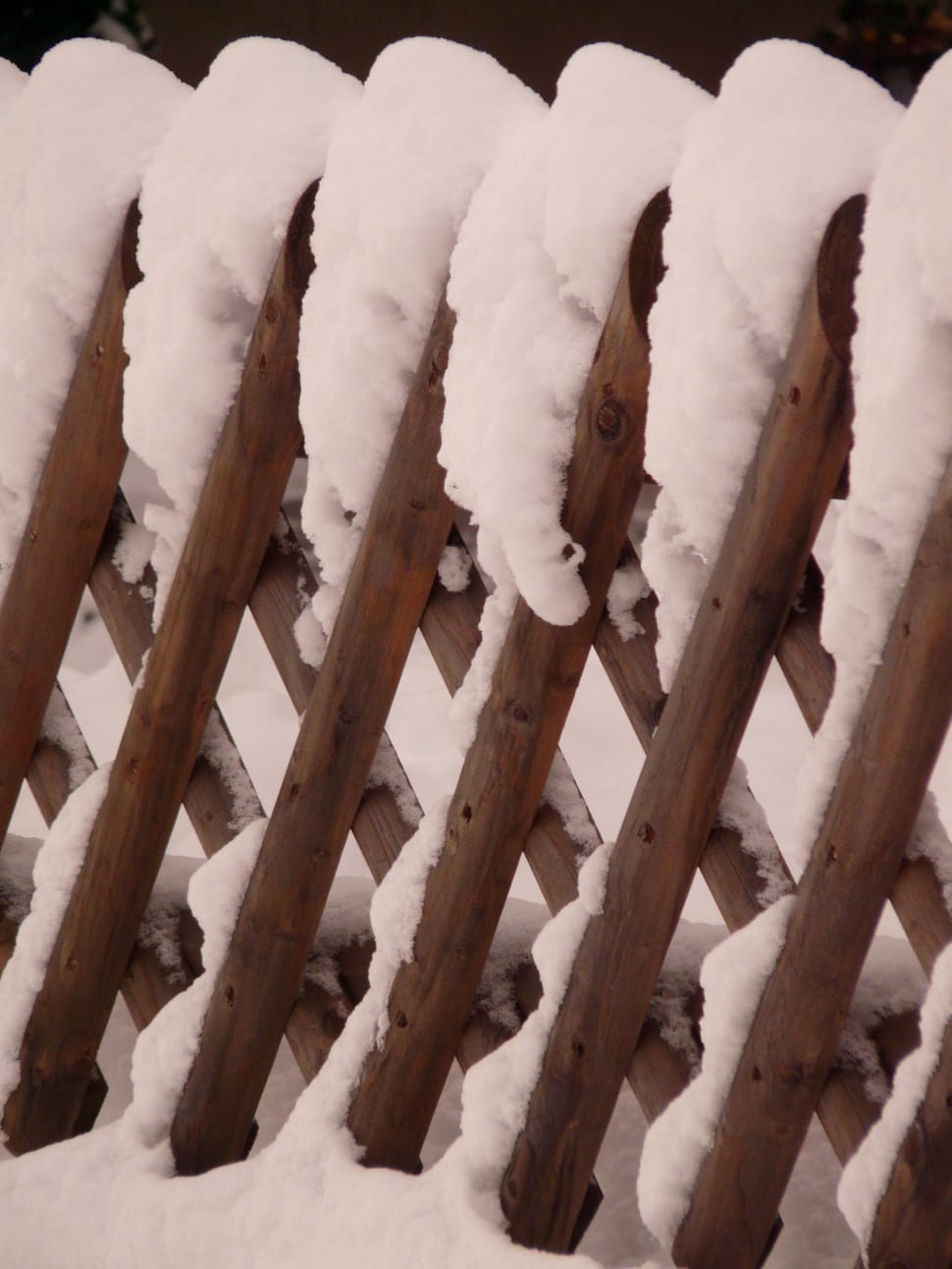 brown wooden snow covered fence preview