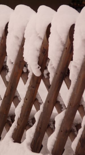 brown wooden snow covered fence thumbnail