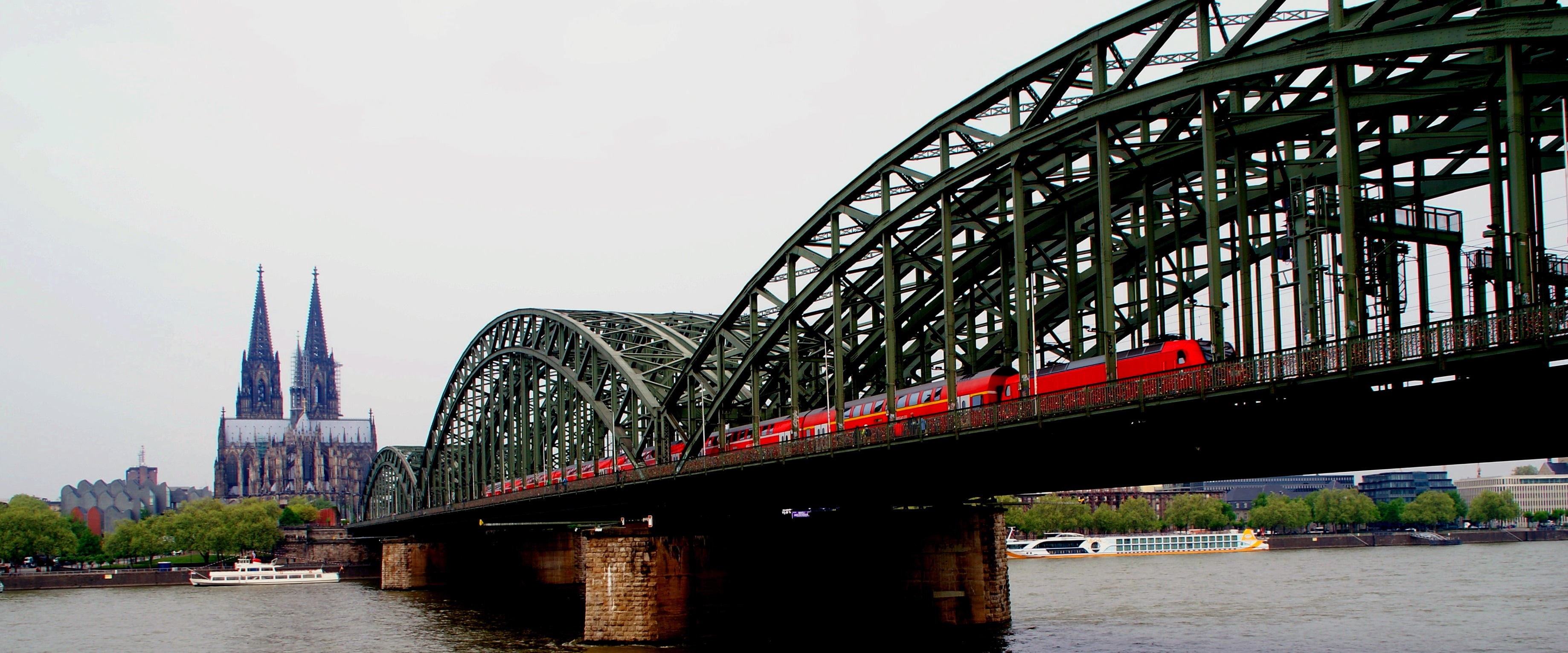 black metal bridge and red train