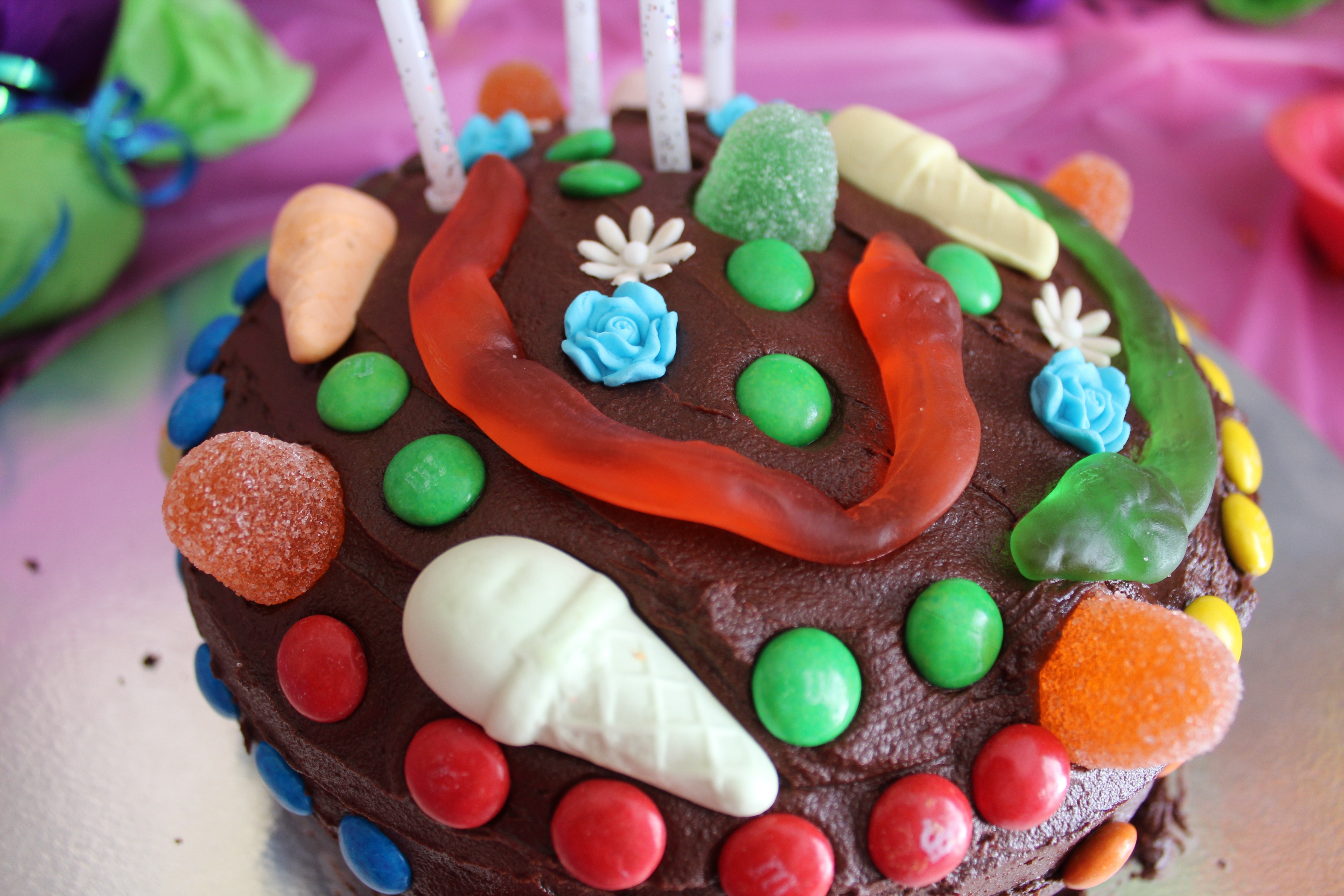 cupcake with chocolate coted with jelly candies