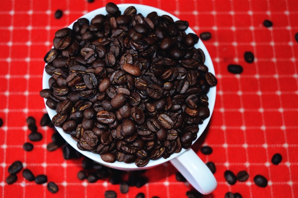black coffee beans and white ceramic mug preview