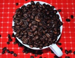 black coffee beans and white ceramic mug thumbnail
