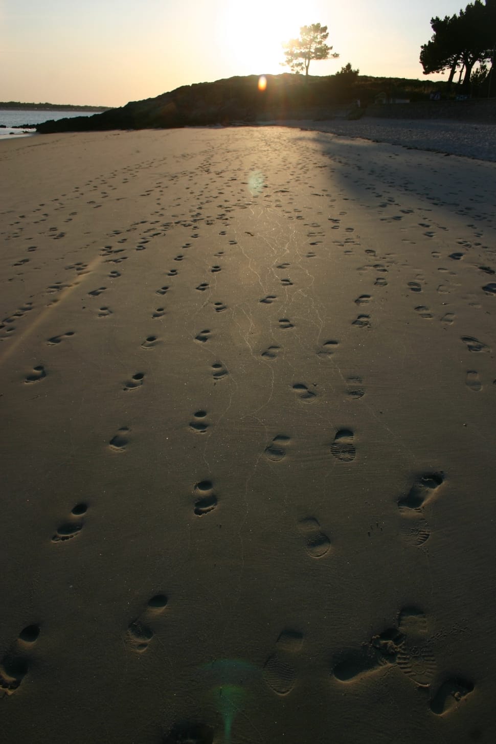 grey sand with footprints during twilight preview