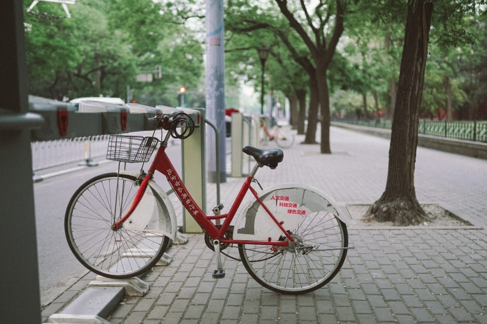red commuter bike near road preview