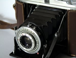 black and brown folding camera thumbnail