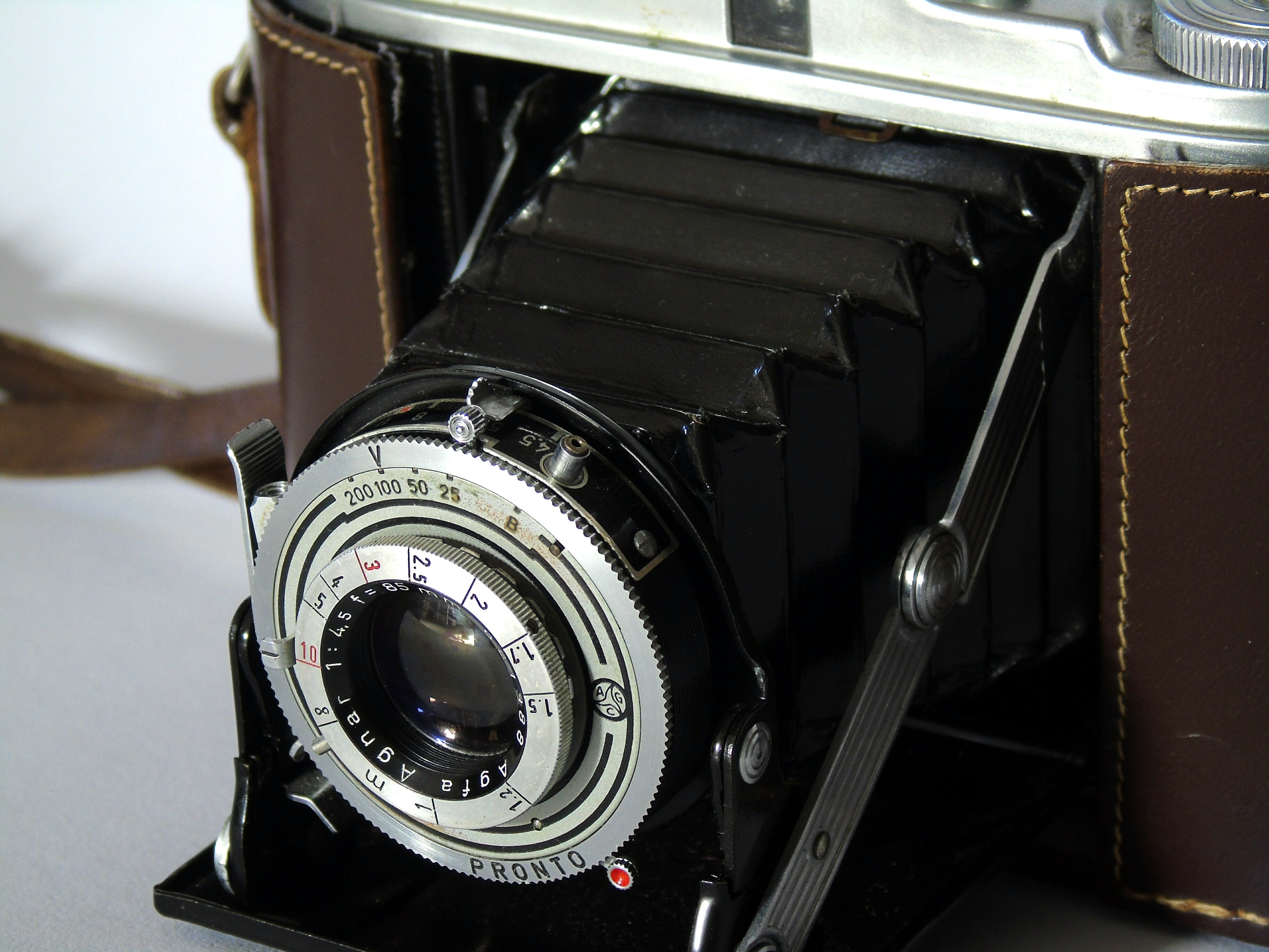 black and brown folding camera
