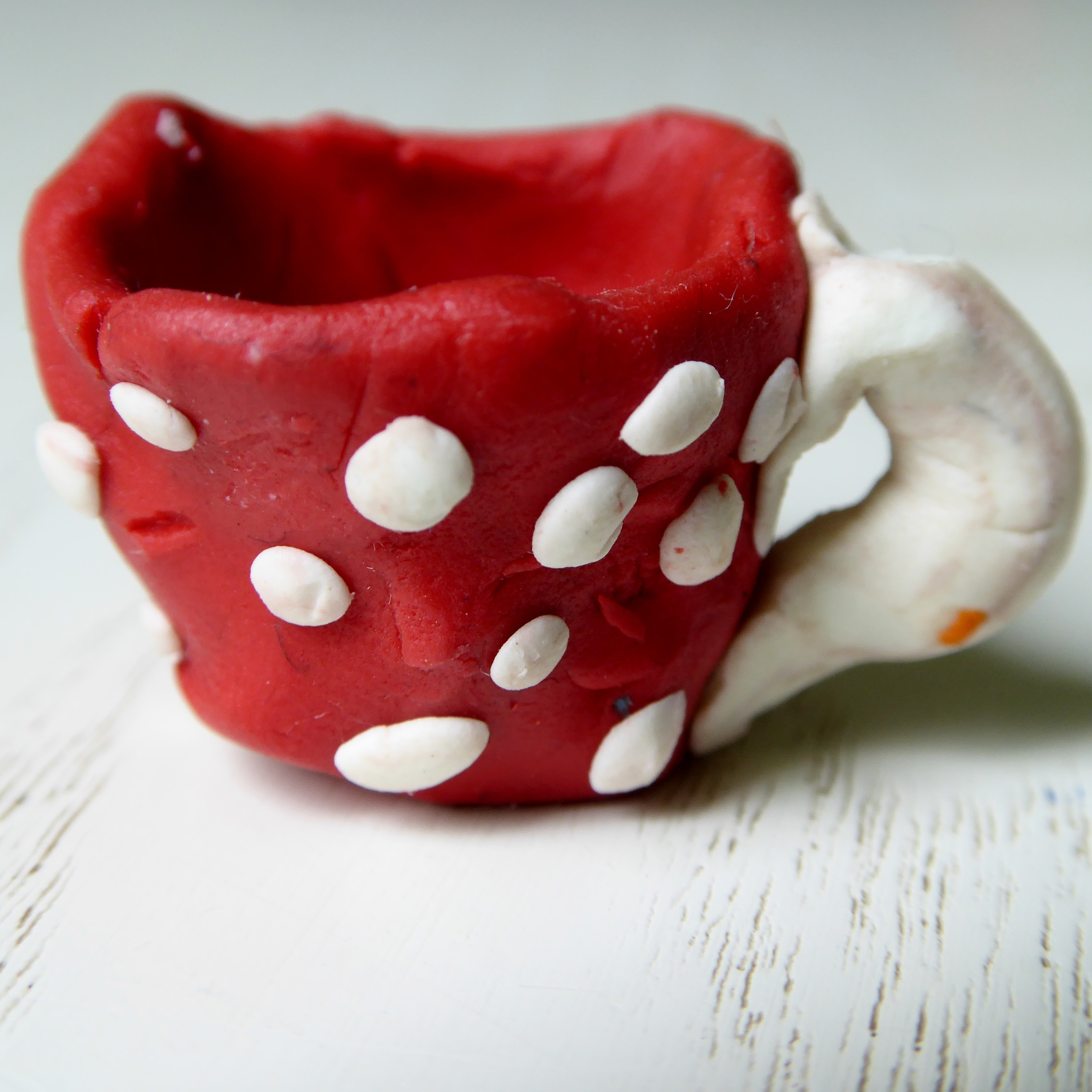 red and white cup ornament