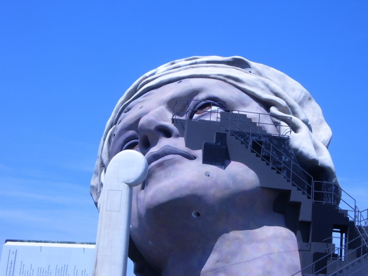 woman's head concrete statue
