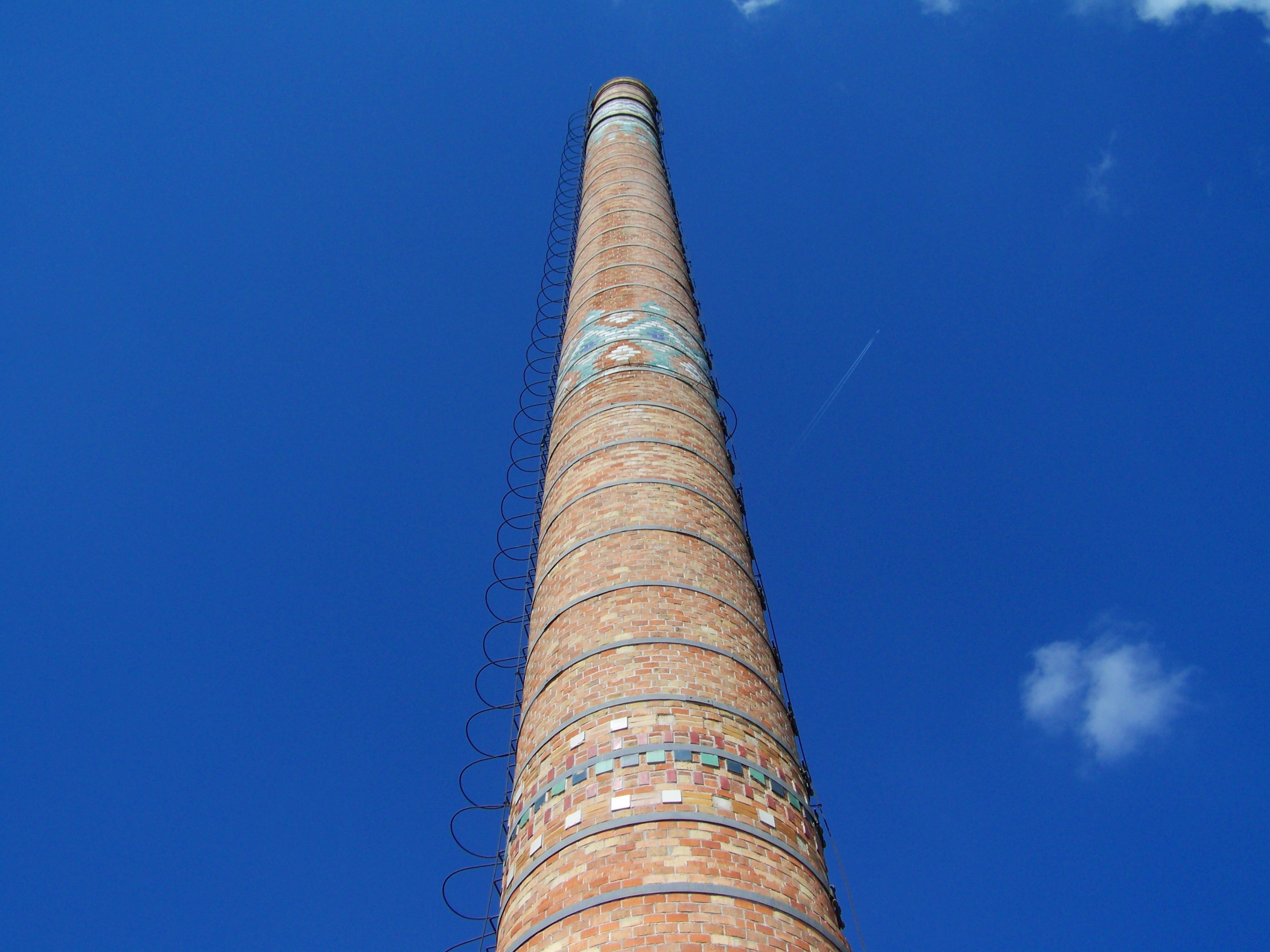 low angle photography of brown brick pillar building