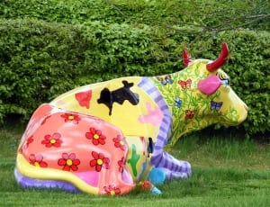 yellow green purple and red floral sitting cow stature thumbnail
