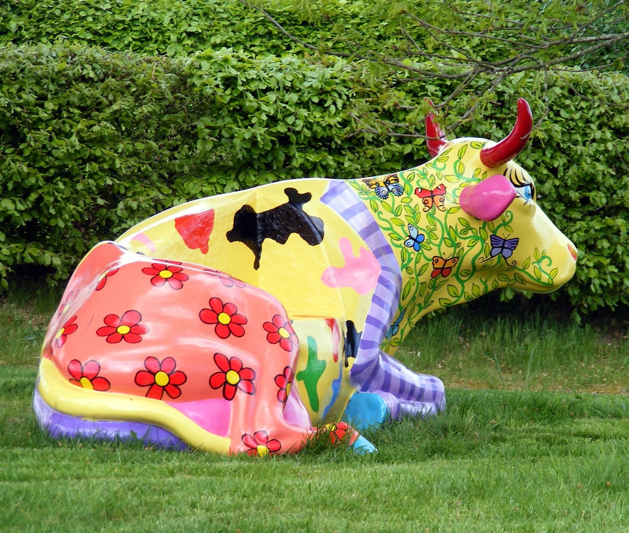 yellow green purple and red floral sitting cow stature