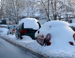 photo of red car covered by snow thumbnail