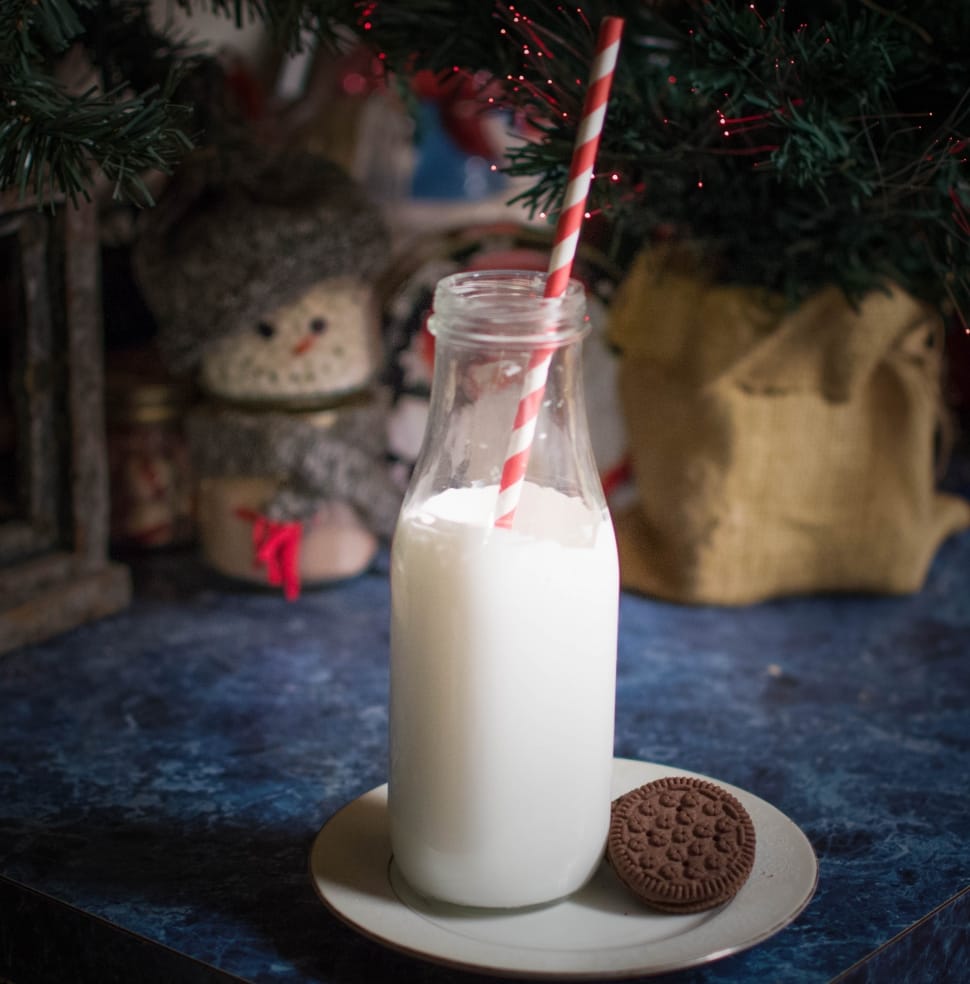 clear milk bottle with straw and cookie preview