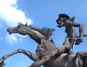 man riding horse black statute thumbnail
