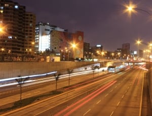 timelapse photography of road in cityscape thumbnail