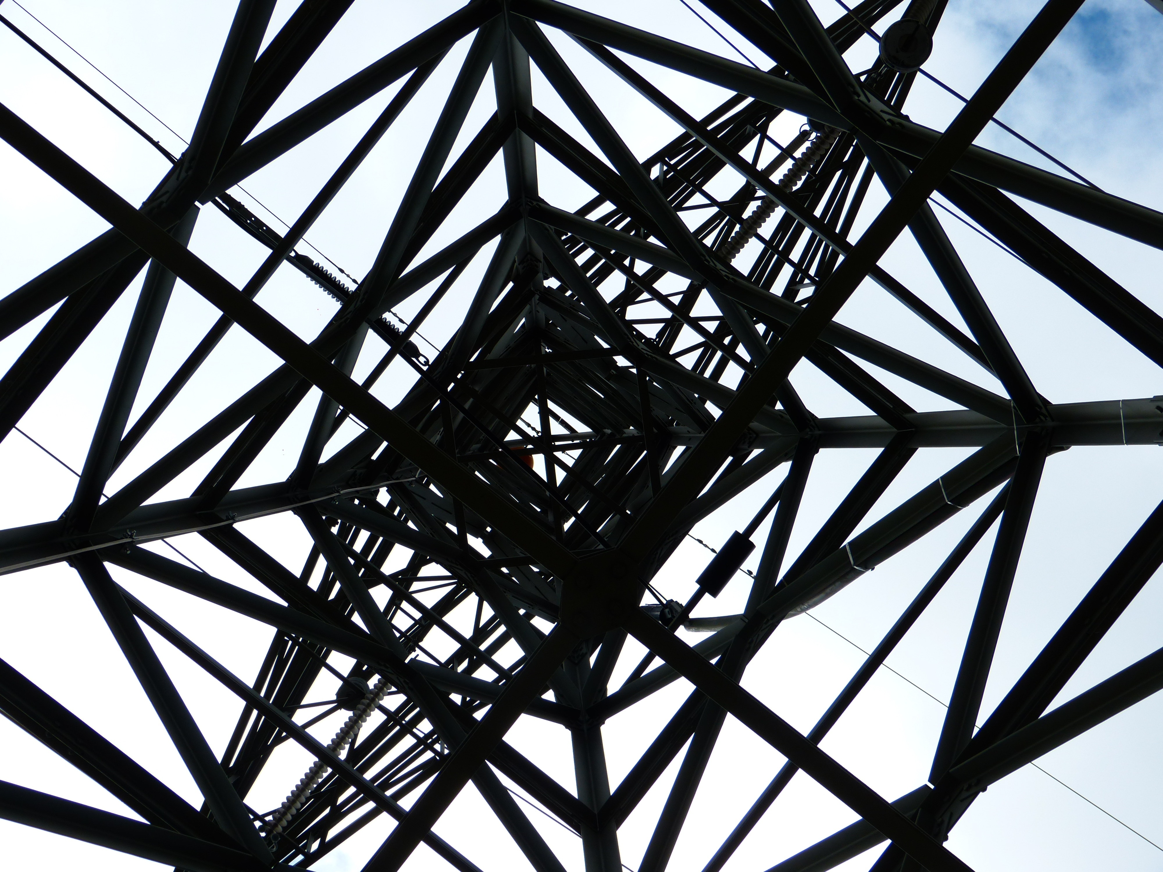 black metal electric tower at daytime