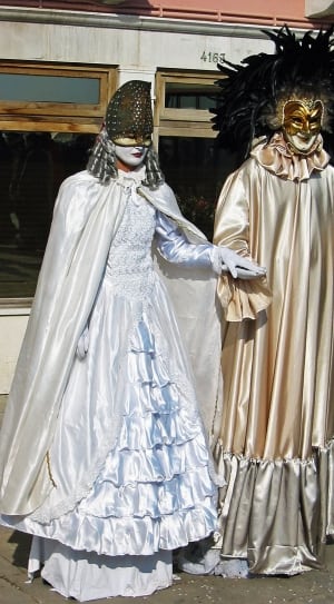 two person wearing costume and mask standing on gray concrete floor thumbnail