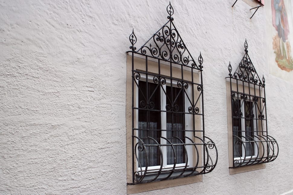 photo of black metal wrought window frame preview