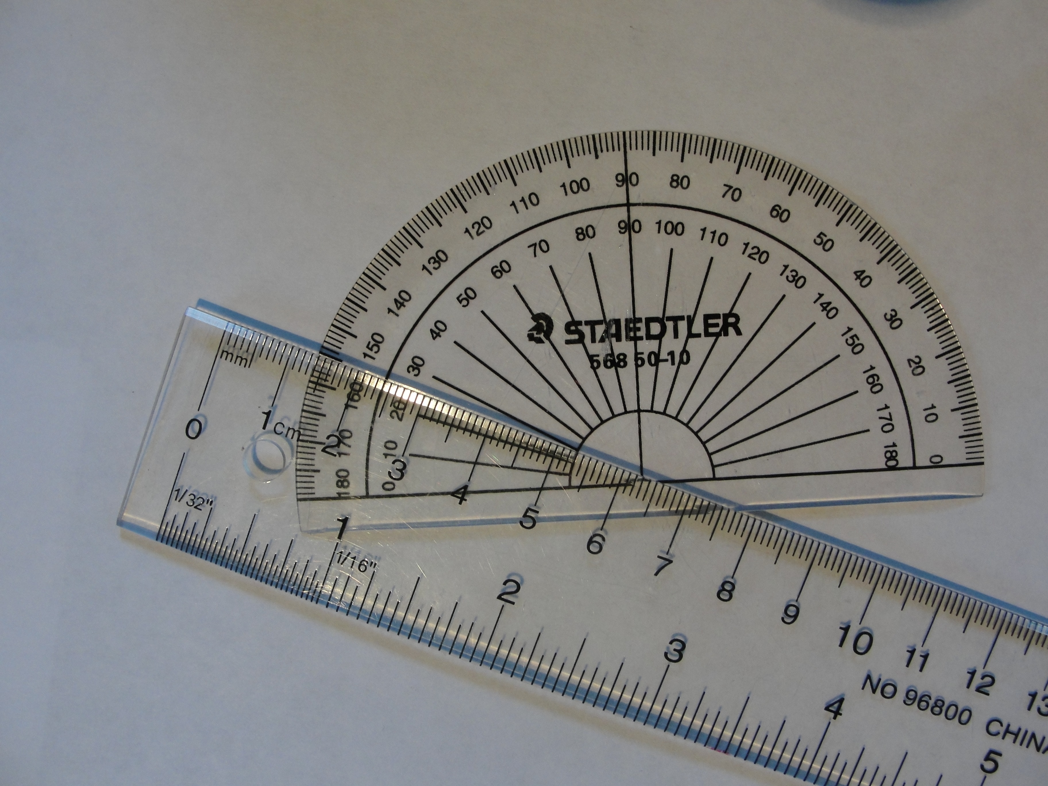 two ruler on top of white surface
