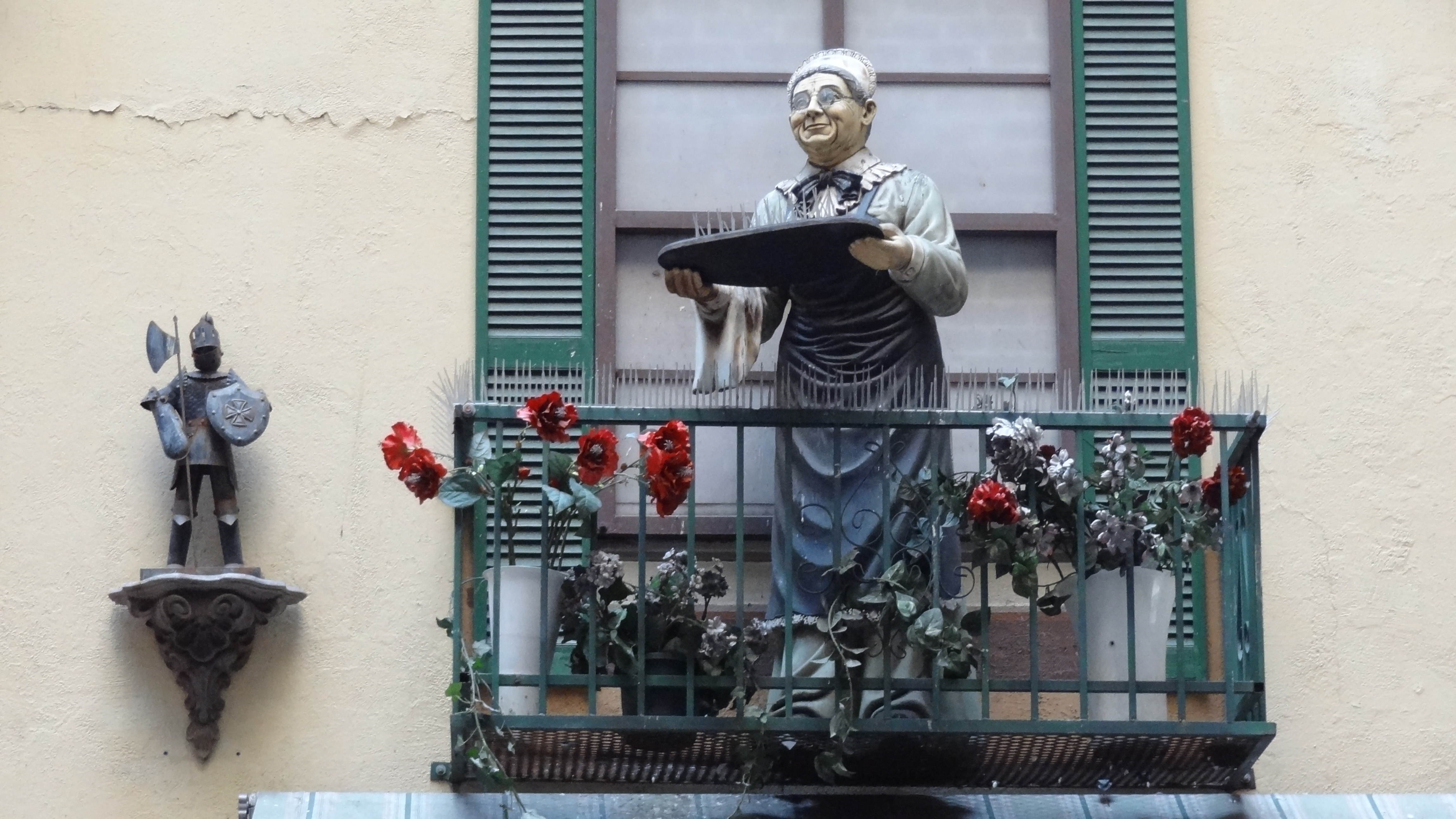 chef holding tray statue