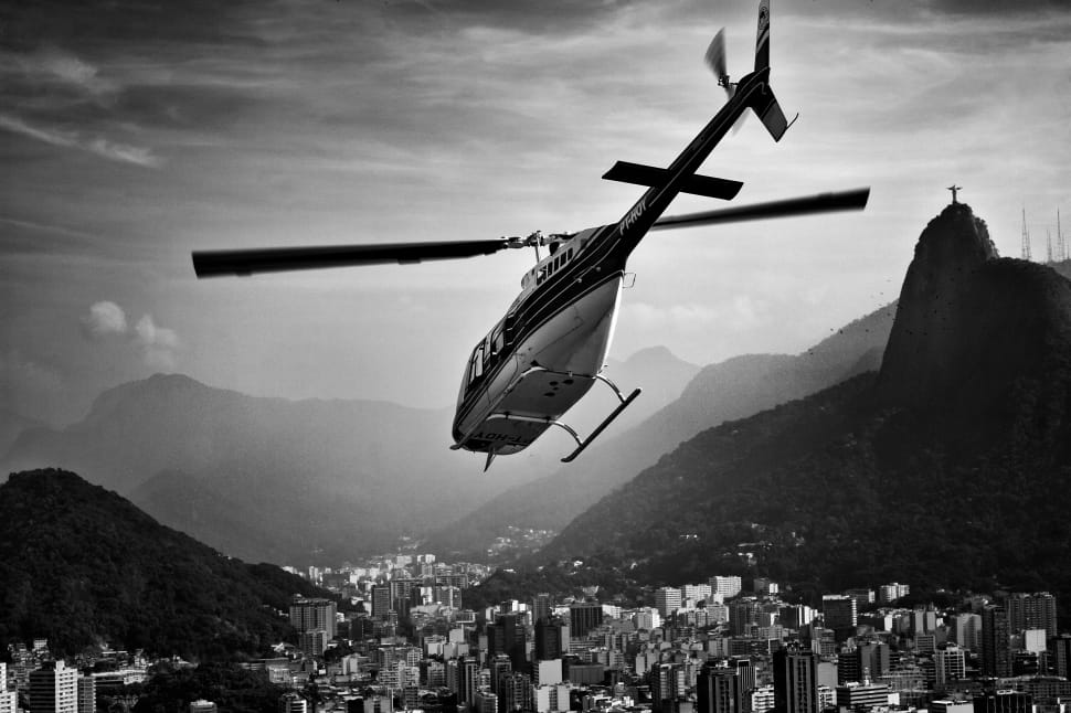 grayscale photo of flying helicopter preview