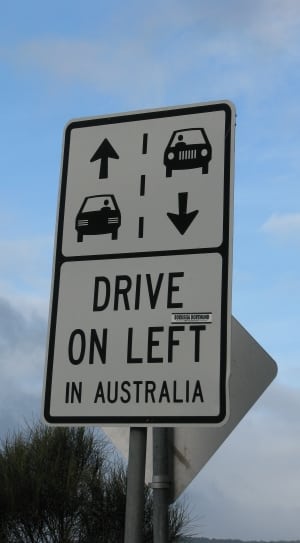 white and black drive on left in australia signage thumbnail