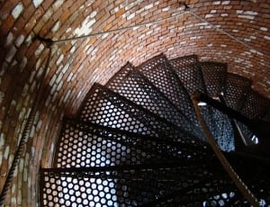 black metal spiral stair in brown wooden tower thumbnail