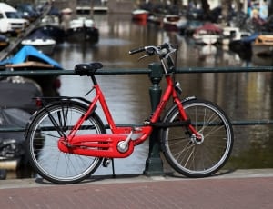 red and black step through bicycle thumbnail