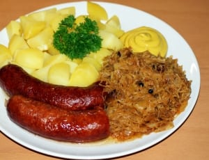 sausage with potato slices and cheese dip dish thumbnail