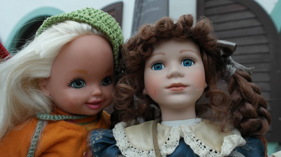 2 dolls wearing green knit cap and white lace peter pan collar preview