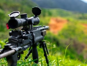 closed up photo of sniper riffle on grass thumbnail
