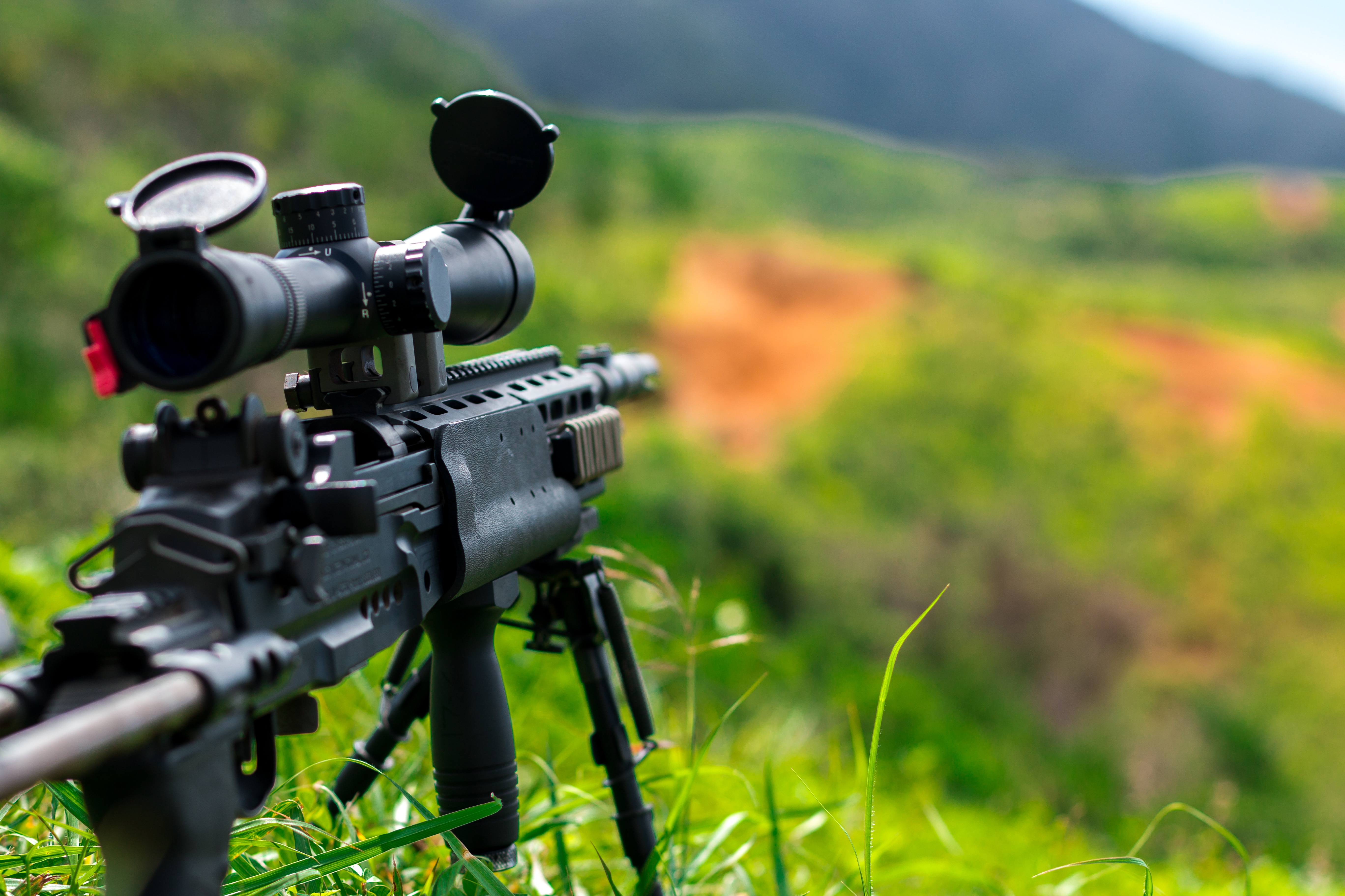 closed up photo of sniper riffle on grass