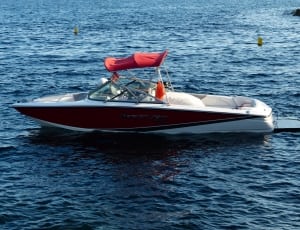 brown and white speed boat thumbnail