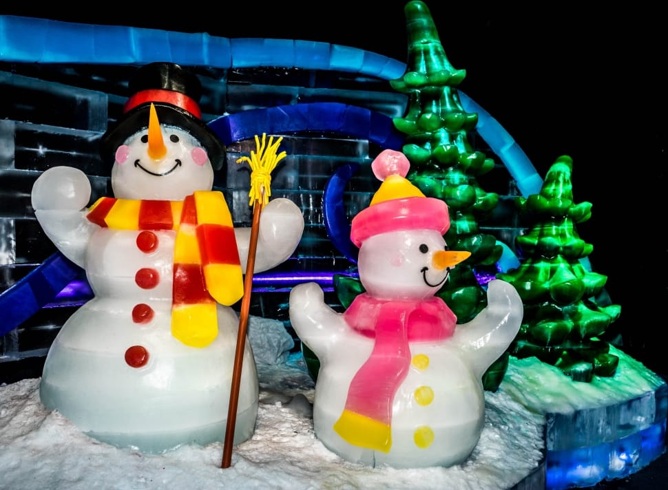 two snowman wearing scarves figurines preview