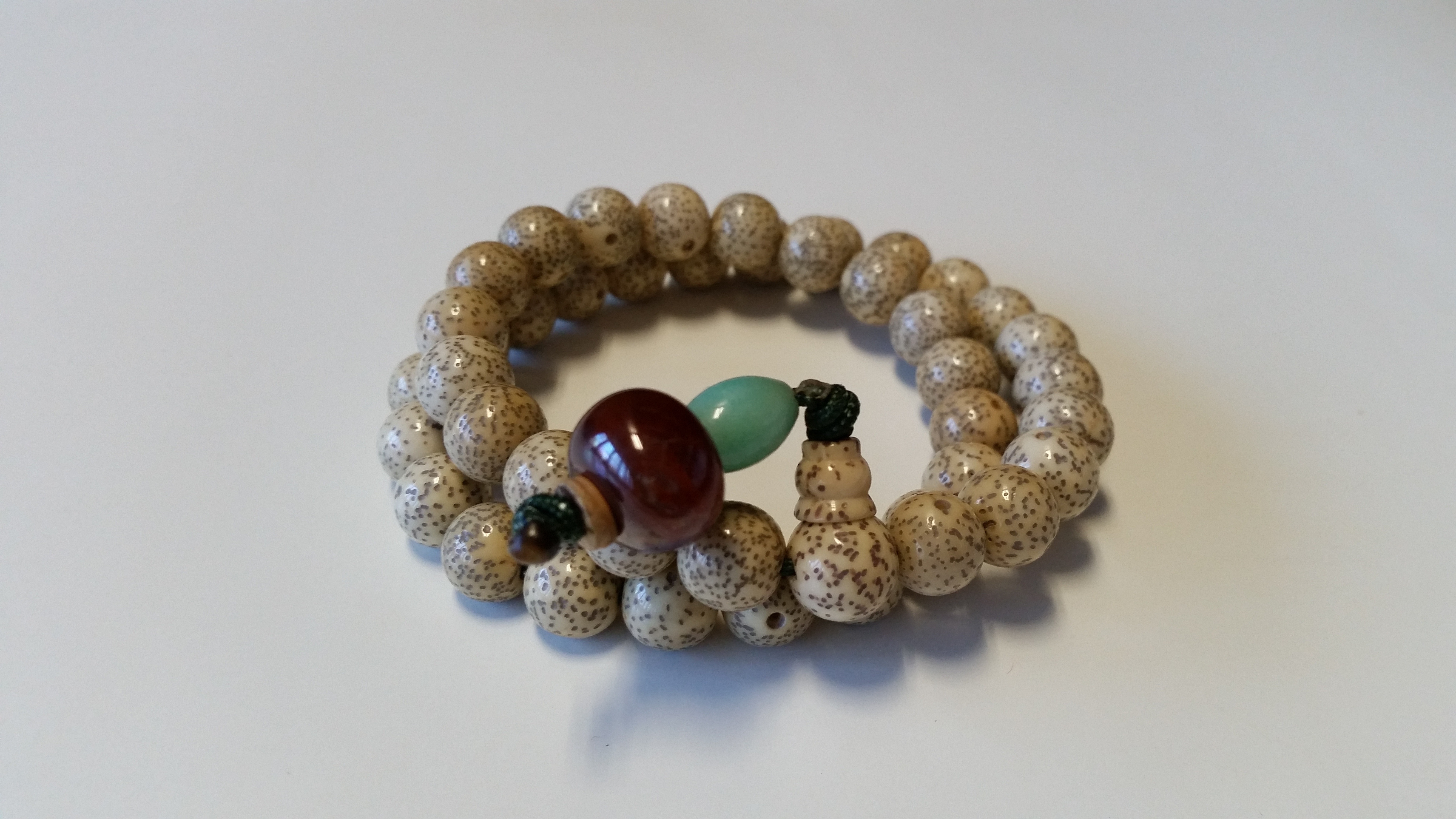 white and brown beaded bracelet