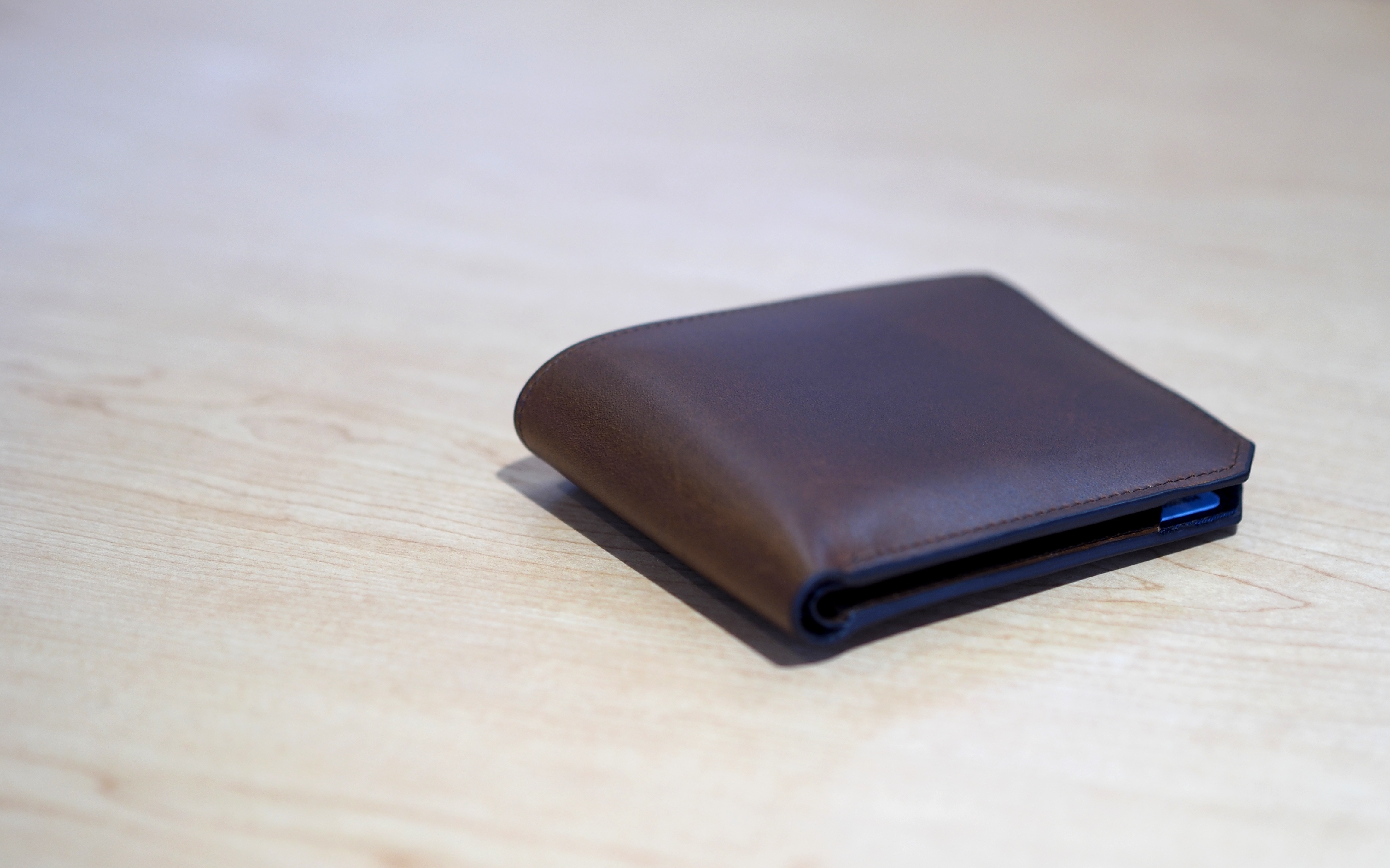 brown leather bi-fold wallet