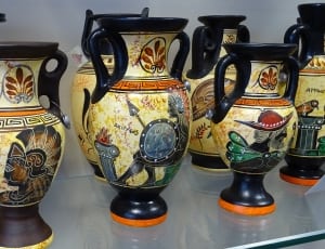 beige and black ceramic vase collection thumbnail