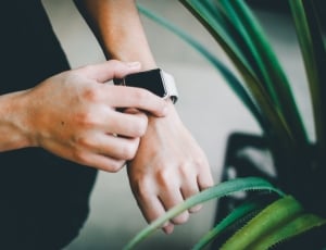 person holding smartwatch thumbnail