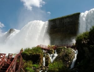 waterfalls and brown wooden staircase thumbnail