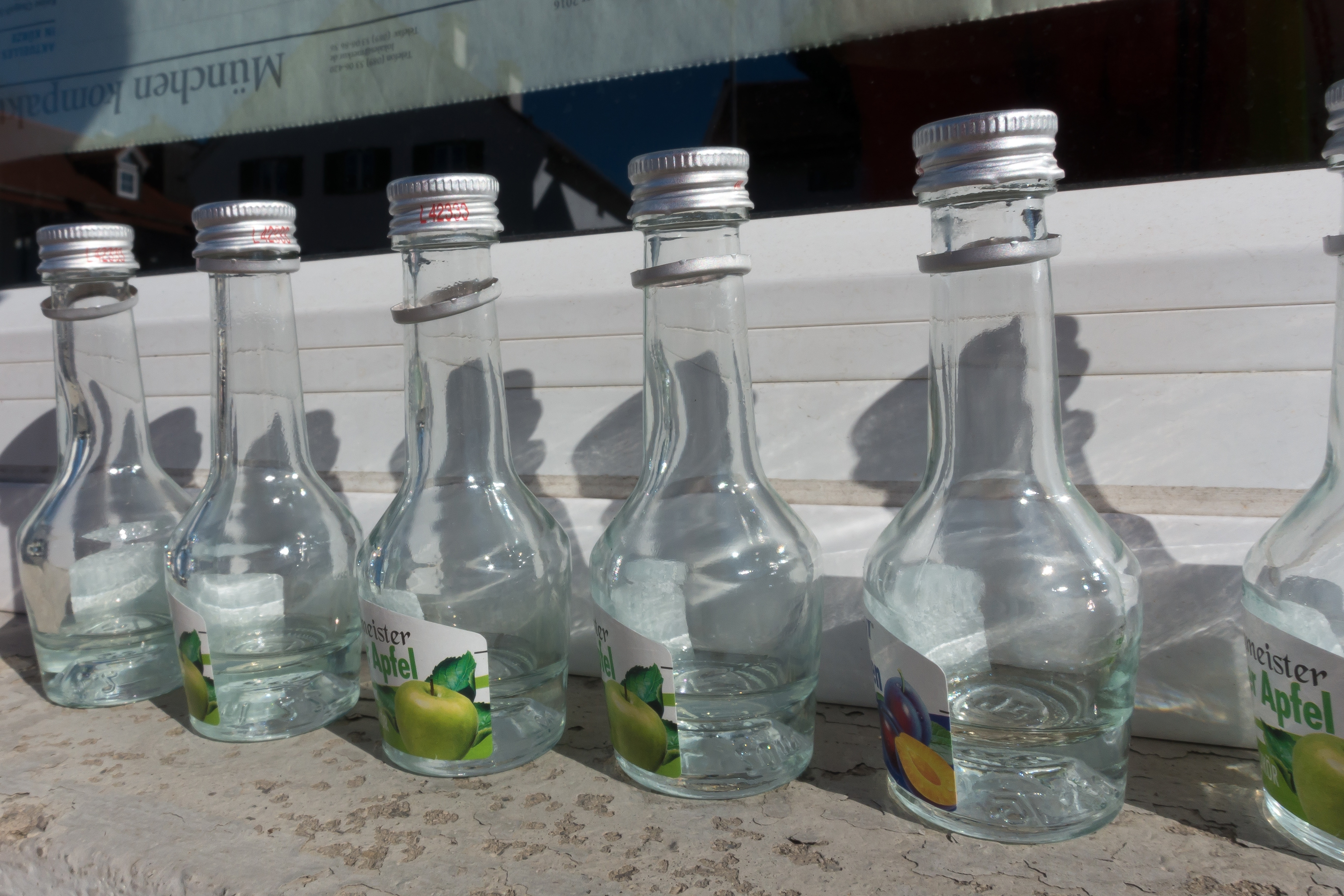 5 clear glass bottles
