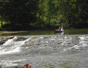 two person riding raft on body of water during daytime thumbnail