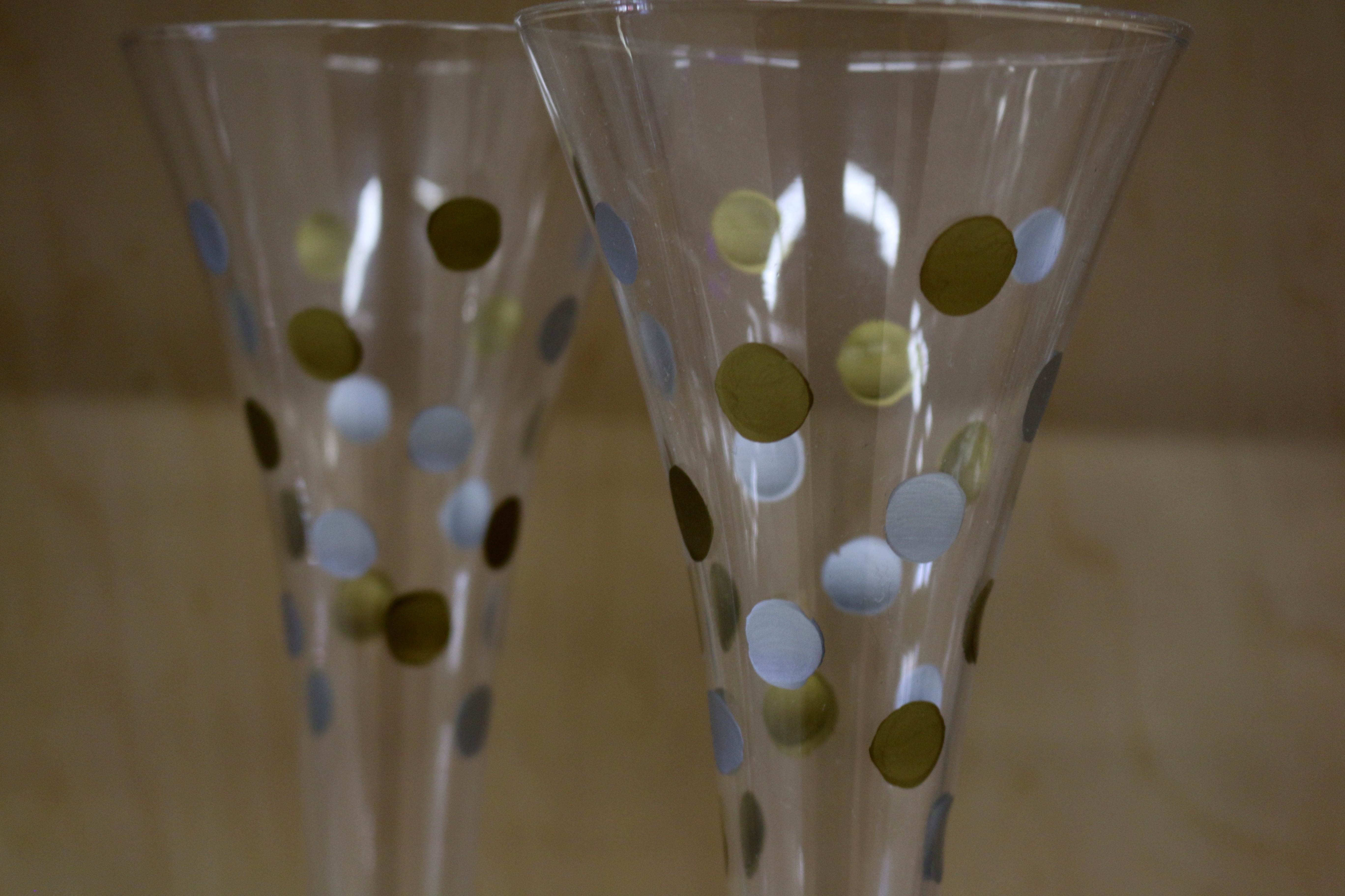 2 green and blue polka dotted glasses