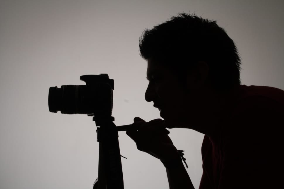 silhouette of man taking photo preview