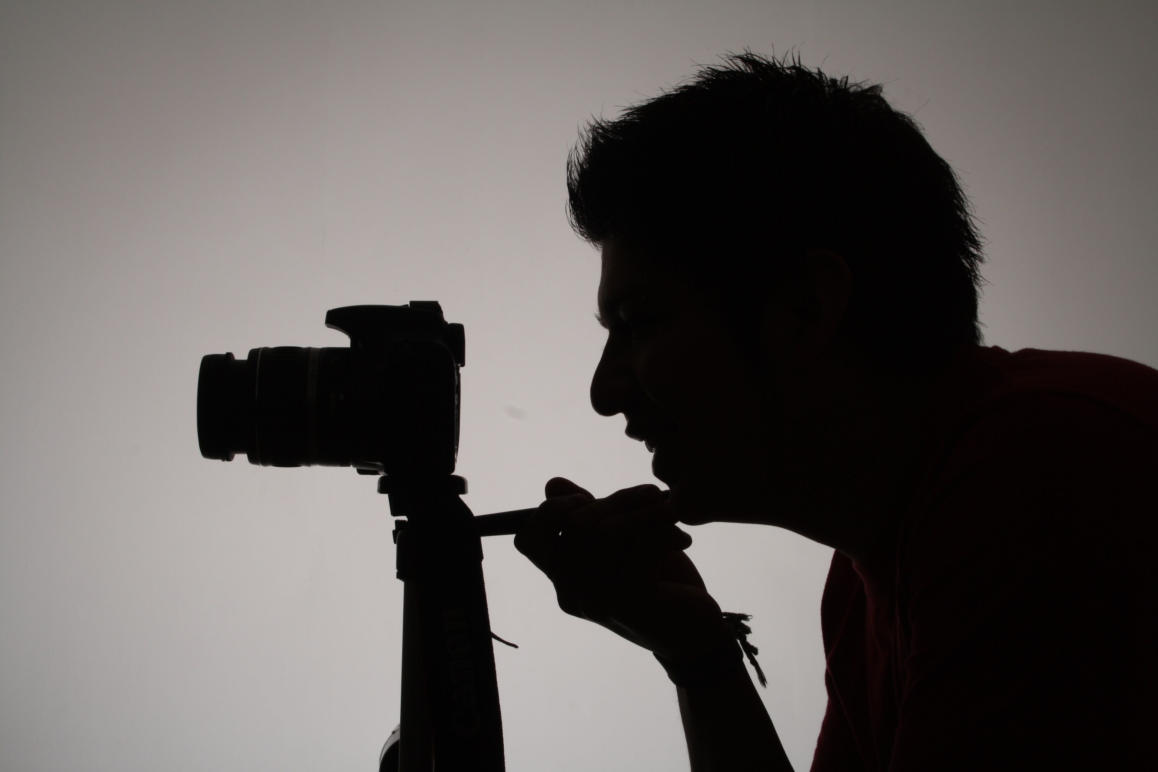 silhouette of man taking photo