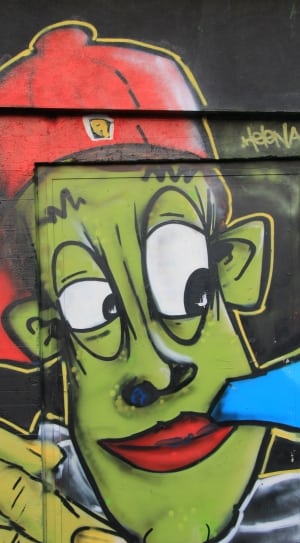 green black and red human grafitti thumbnail