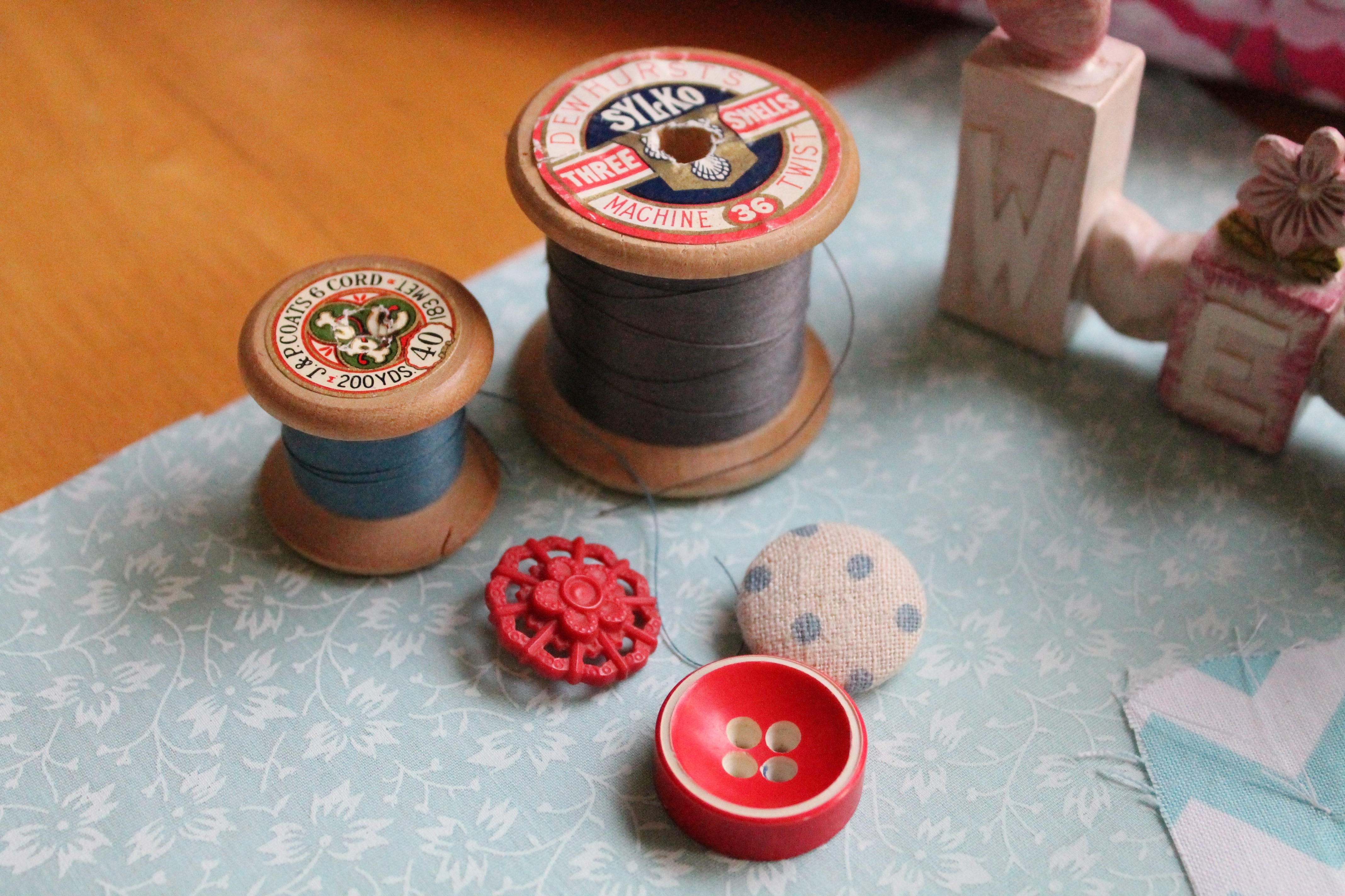 wooden thread spools and clothes button