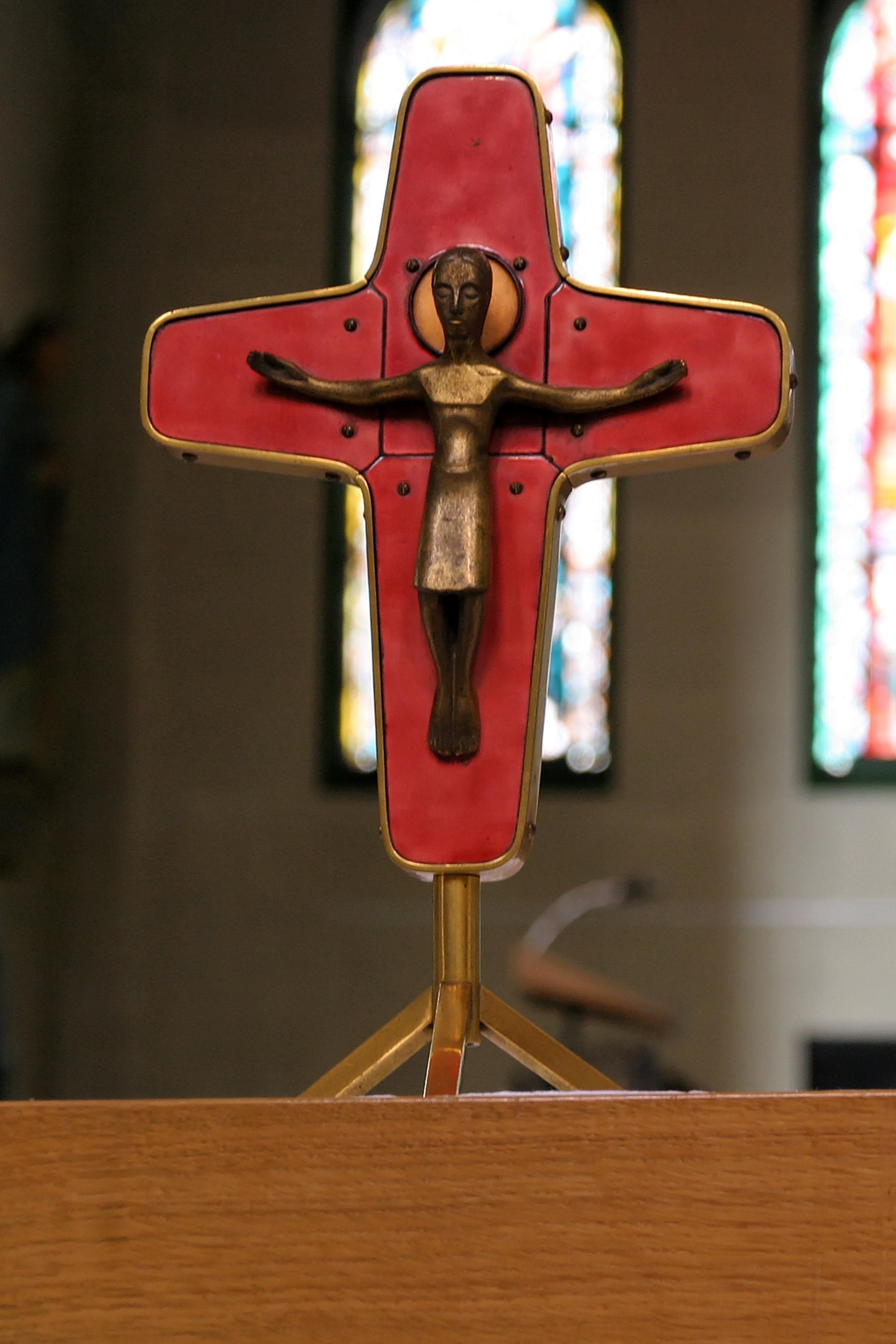red and brass crucifix ornament